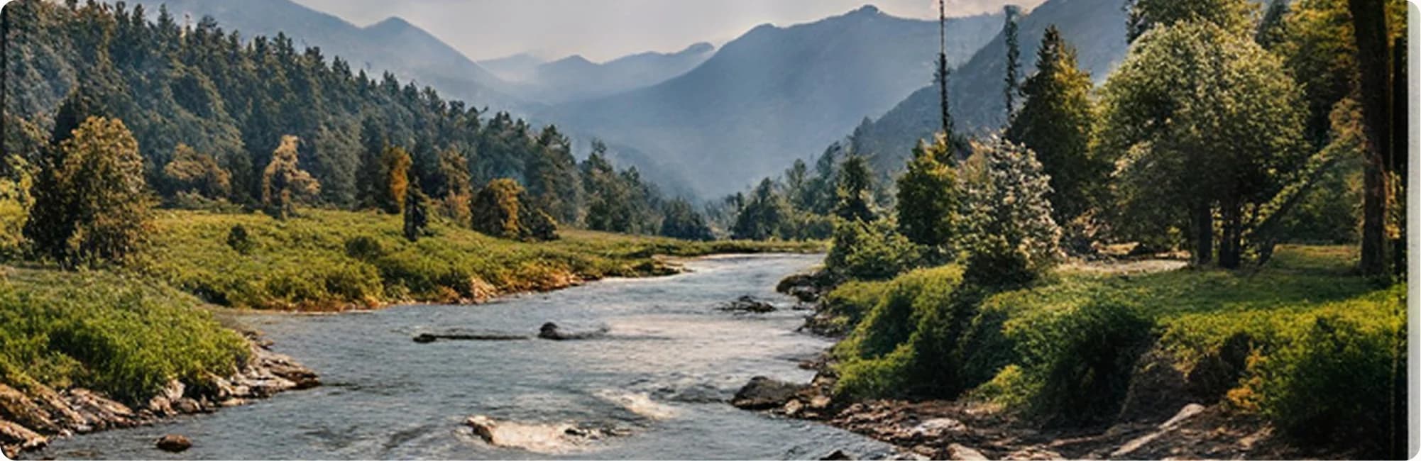 A river winding through a green mountain valley